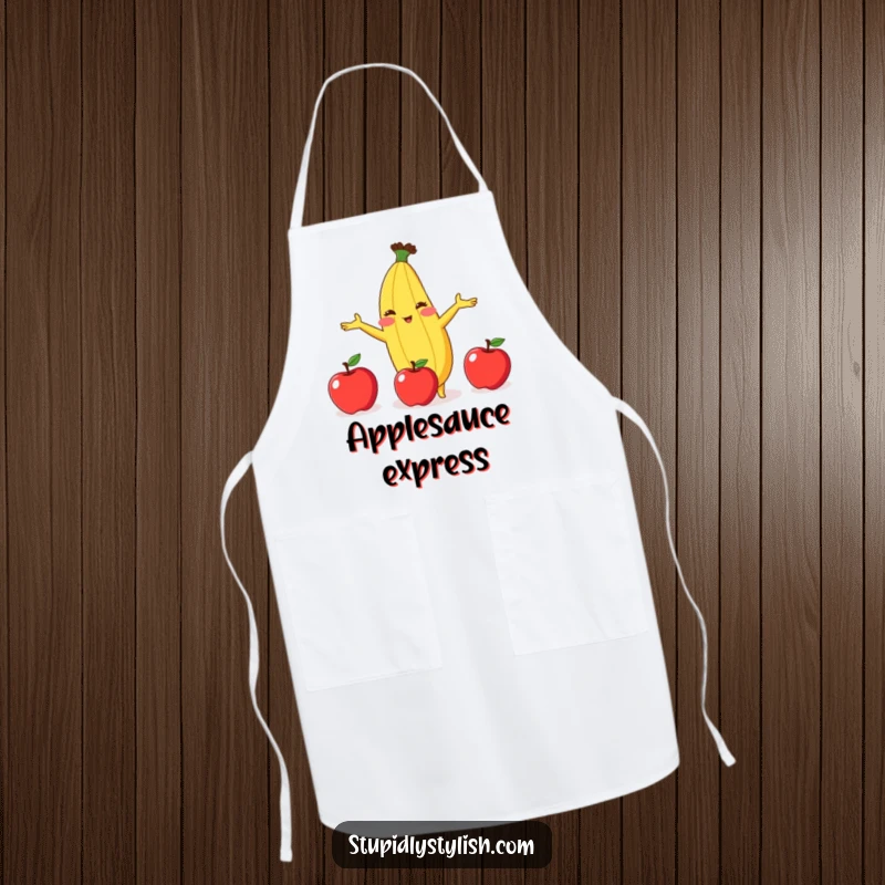Funny kitchen apron with a blushing banana attempting to juggle three apples, adding a humorous touch to cooking.
