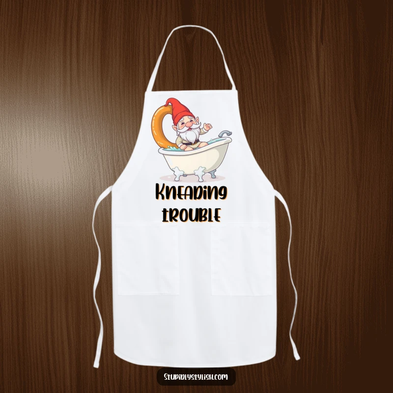 Funny apron featuring a confused garden gnome surfing a giant pretzel in a bathtub. Humorous kitchen wear for quirky chefs.