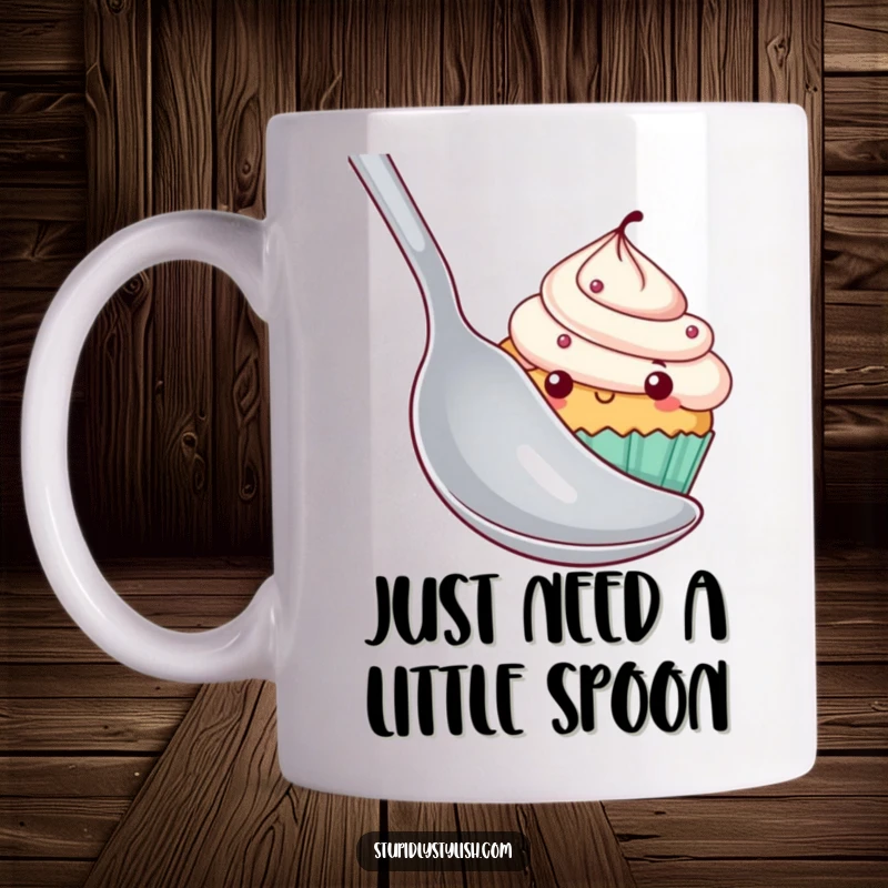 Funny cupcake mug featuring a shy cupcake peeking from behind a massive spoon, conveying bashfulness and a touch of sweet humor.