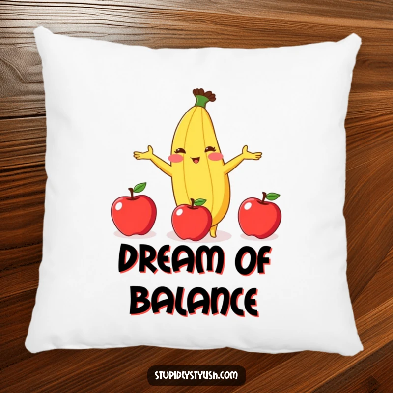 Funny pillow showcasing a blushing banana comically juggling three apples, perfect for adding soft humor to any room.