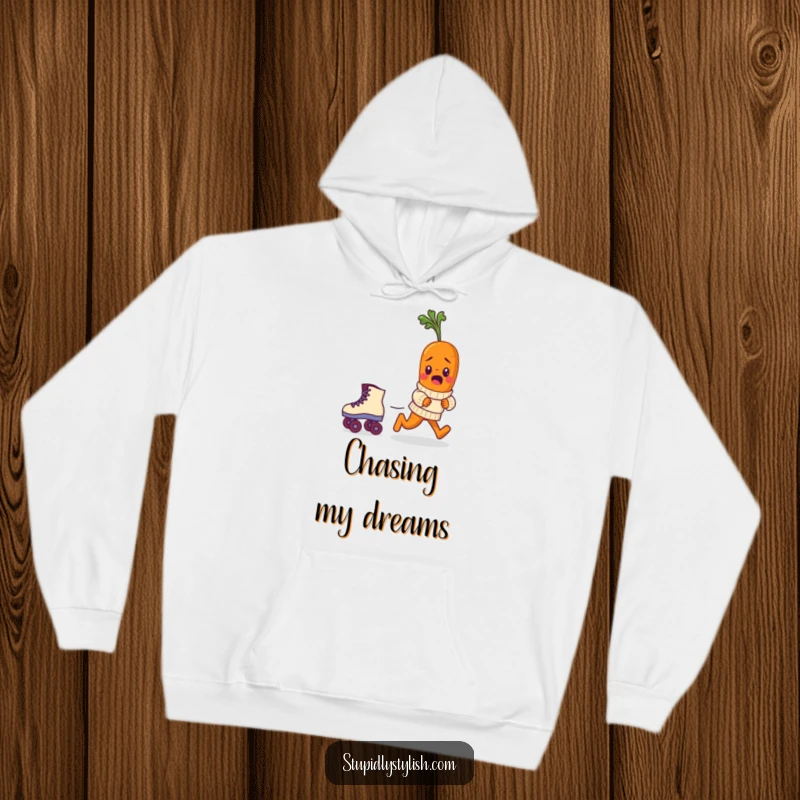 Funny hoodie showing a bewildered baby carrot in a tiny sweater chasing a runaway roller skate, embodying lighthearted cartoon humor.