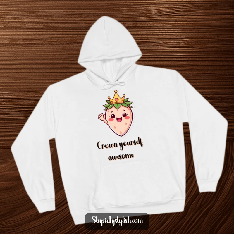 Funny hoodie with a happy strawberry character sporting a miniature crown, enthusiastically waving for a cozy, cheerful vibe.