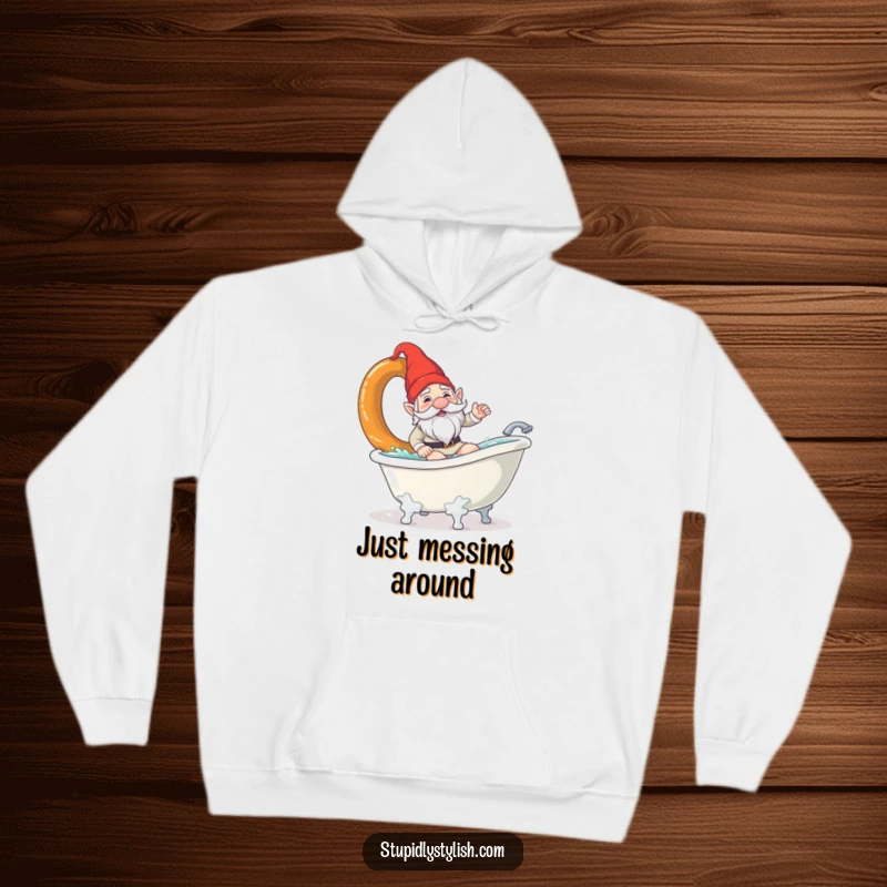 Funny hoodie depicting a confused garden gnome surfing a giant pretzel in a bathtub. Cozy and comical wear for gnome lovers.