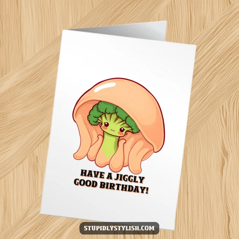 Funny Free Printable Birthday Card: a shy broccoli floret peeking from behind a giant wobbly jelly, sharing a secret smile.