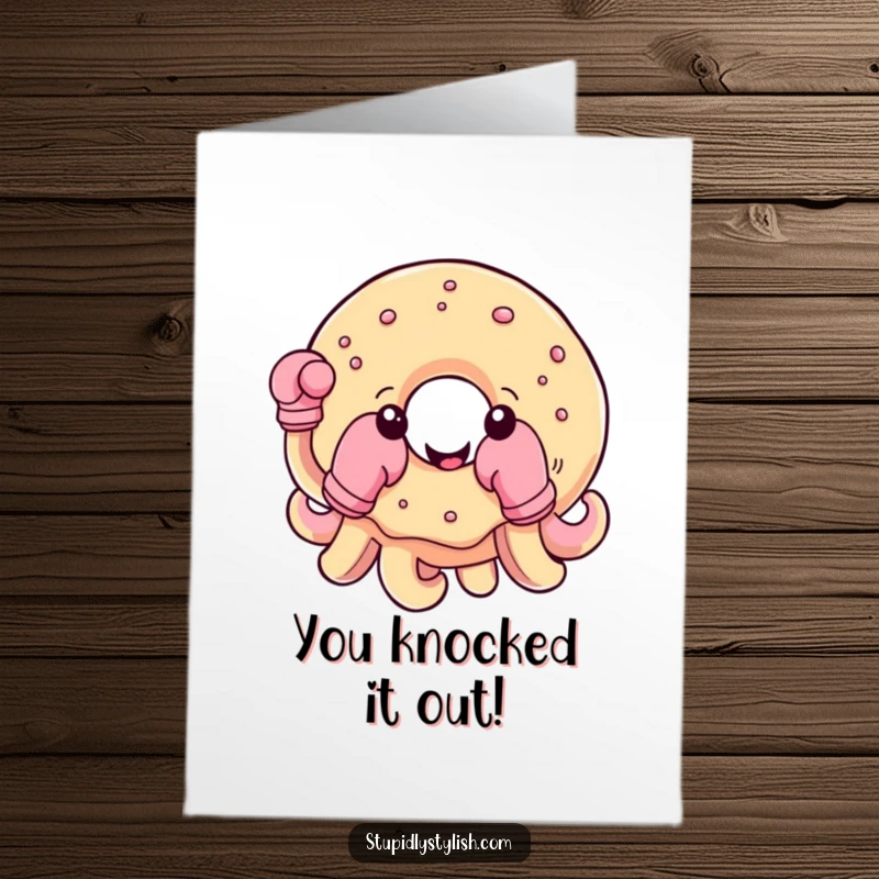 Funny Free Printable Congrats Card: A round donut with boxing gloves on tentacles, celebrating a win.
