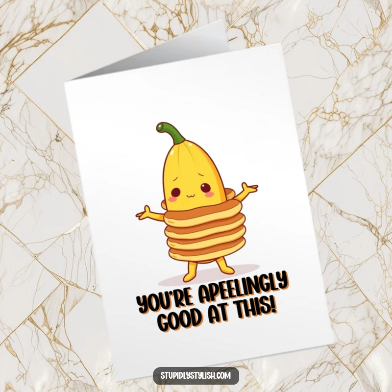 Funny Free Printable Congratulations Card featuring a banana character attempting to balance a precarious stack of pancakes.