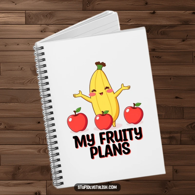 Funny notebook cover featuring a blushing anthropomorphic banana struggling comically to juggle three apples, inspiring creative notes.