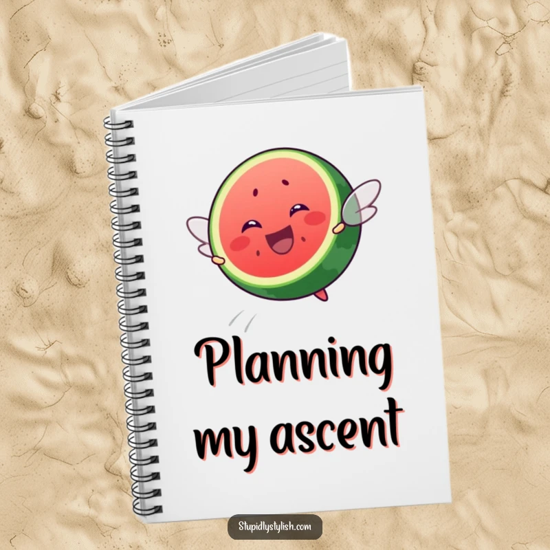 Funny notebook cover with a happy watermelon slice attempting flight, inspiring creativity and bringing a smile to note-taking.