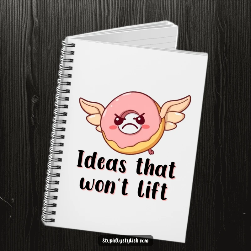 Funny notebook cover illustrated with a grumpy donut attempting flight using pastry wings, looking flustered with humorous determination.