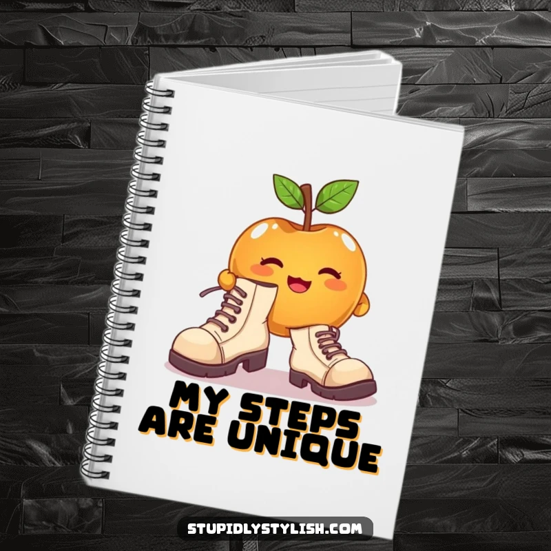 Funny notebook with a cute apple character attempting to wear enormous, mismatched shoes, perfect for jotting ideas.