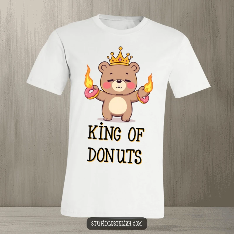 Funny t-shirt art of a regal tiny bear nervously juggling flaming donuts with a look of concentration.