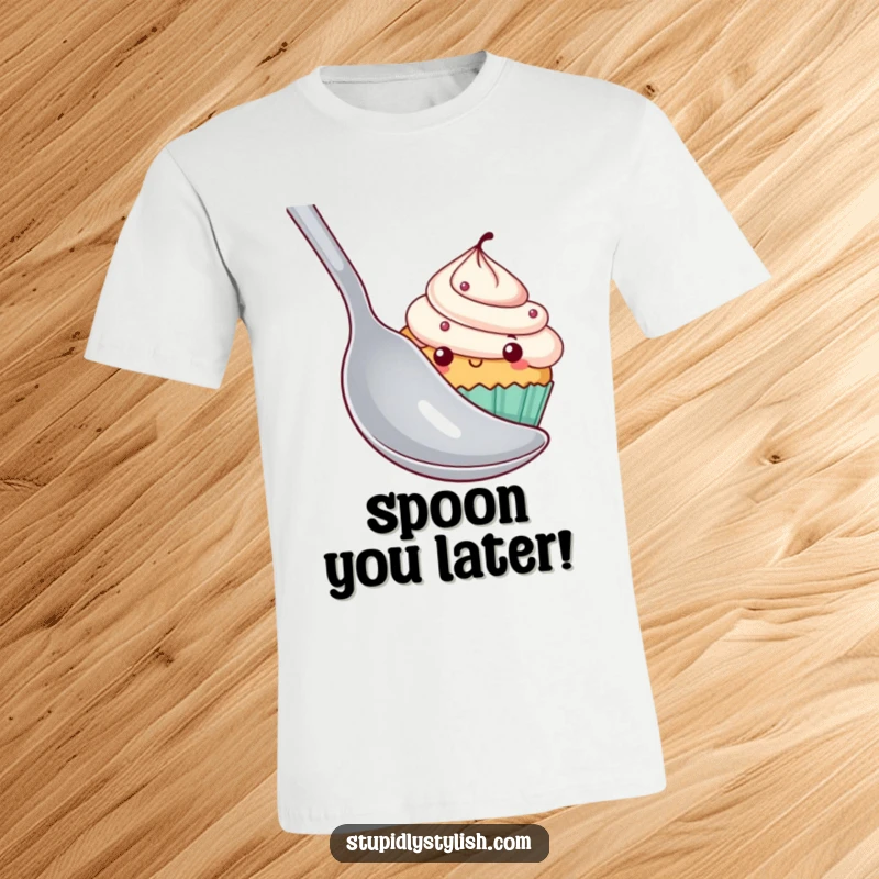 Funny cupcake t-shirt showing a shy cupcake attempting to conceal itself behind an oversized spoon, a cute and humorous design.