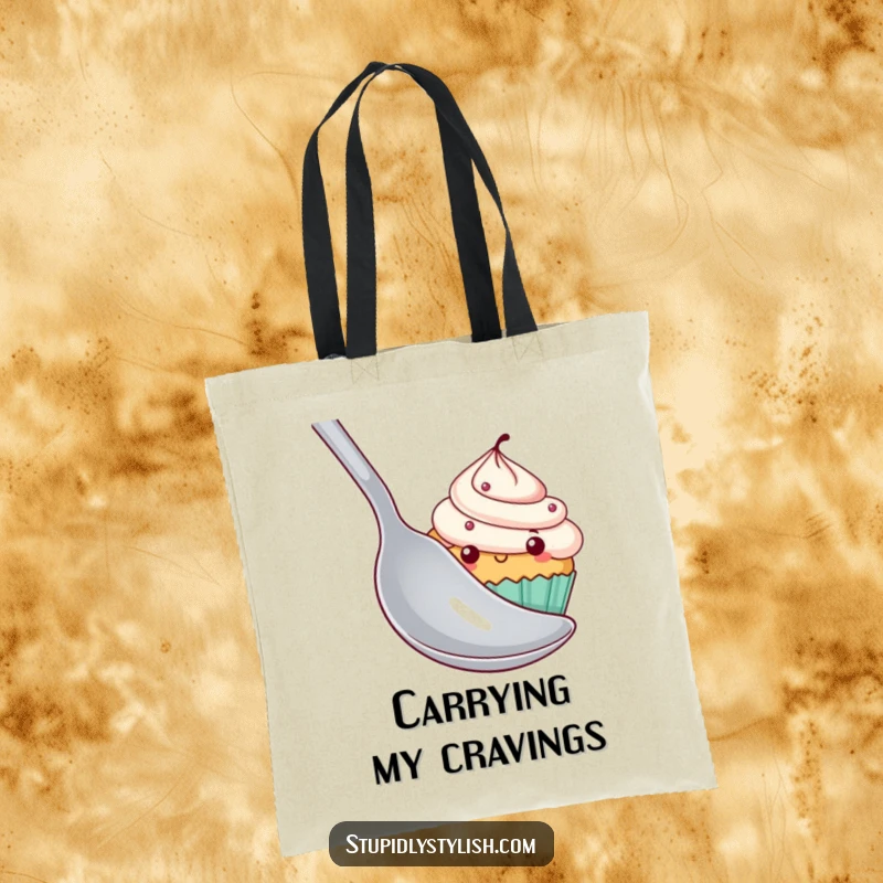 Funny cupcake tote bag depicting a shy cupcake hiding behind a large spoon, perfect for carrying groceries with a dose of cuteness.