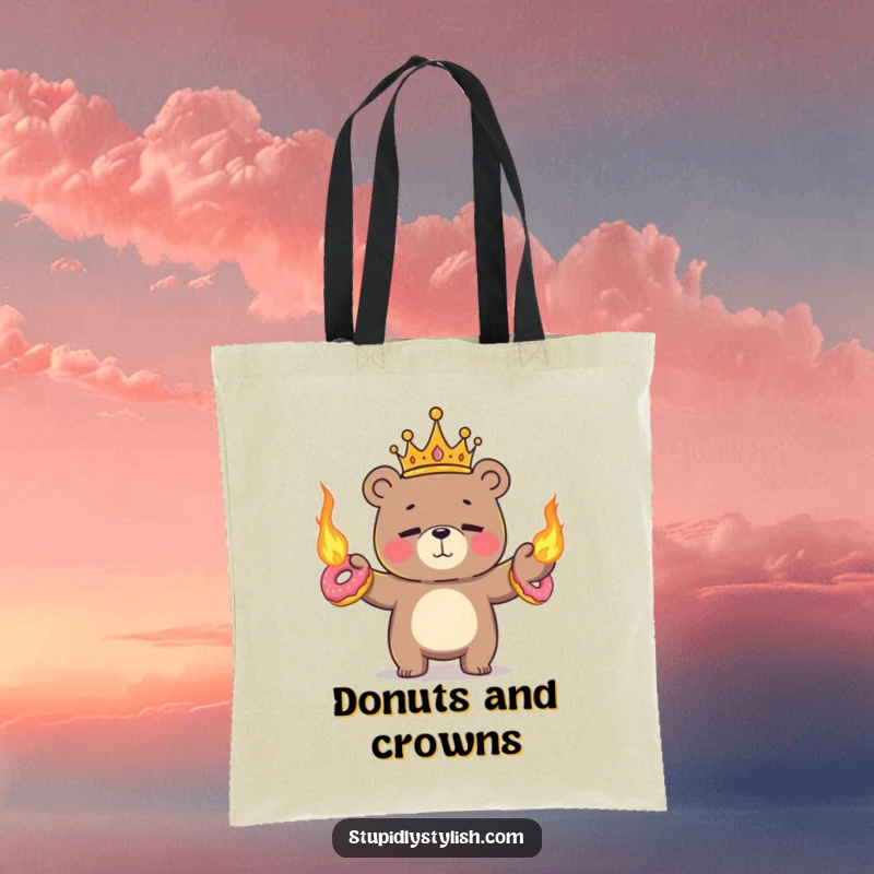 Funny tote bag depicting a tiny crowned bear nervously juggling flaming donuts with a determined, yet anxious, expression.