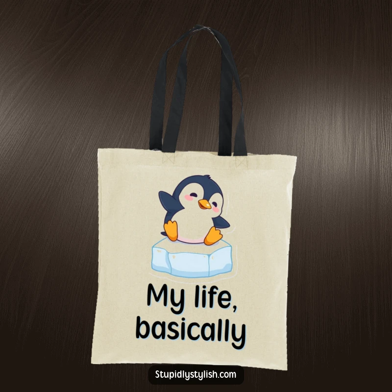 Funny tote bag featuring a clumsy penguin hilariously slipping on an ice cube, great for carrying essentials with humor.